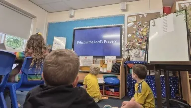 Thousands of English School Children Recite the Lord's Prayer Together