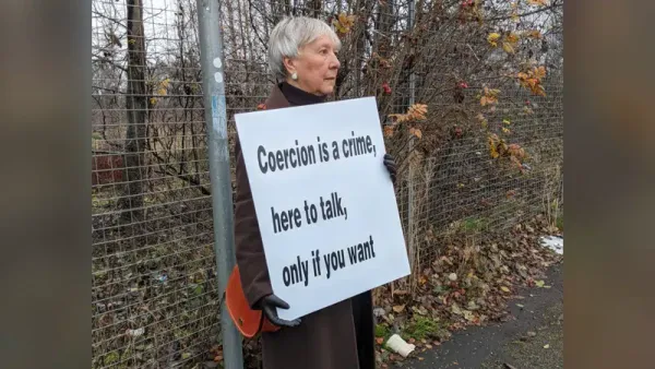 Scotland Prosecutes 75-Year-Old Grandmother For Offering "Here to Talk" Sign
