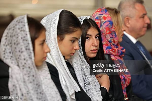 Iranian Christians attend a mass celebrating the Armenian Christmas at the Saint Sarkis Armenian Cathedral in Tehran on January 6, 2026